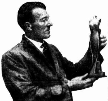 Lyall Randolph Williams with his sculpture 