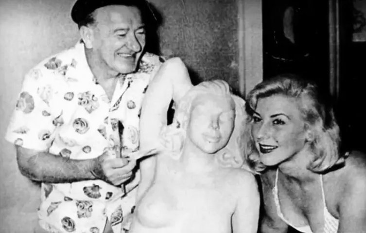 Sculptor Lyall Randolph with Lynette Whillier and mermaid statue